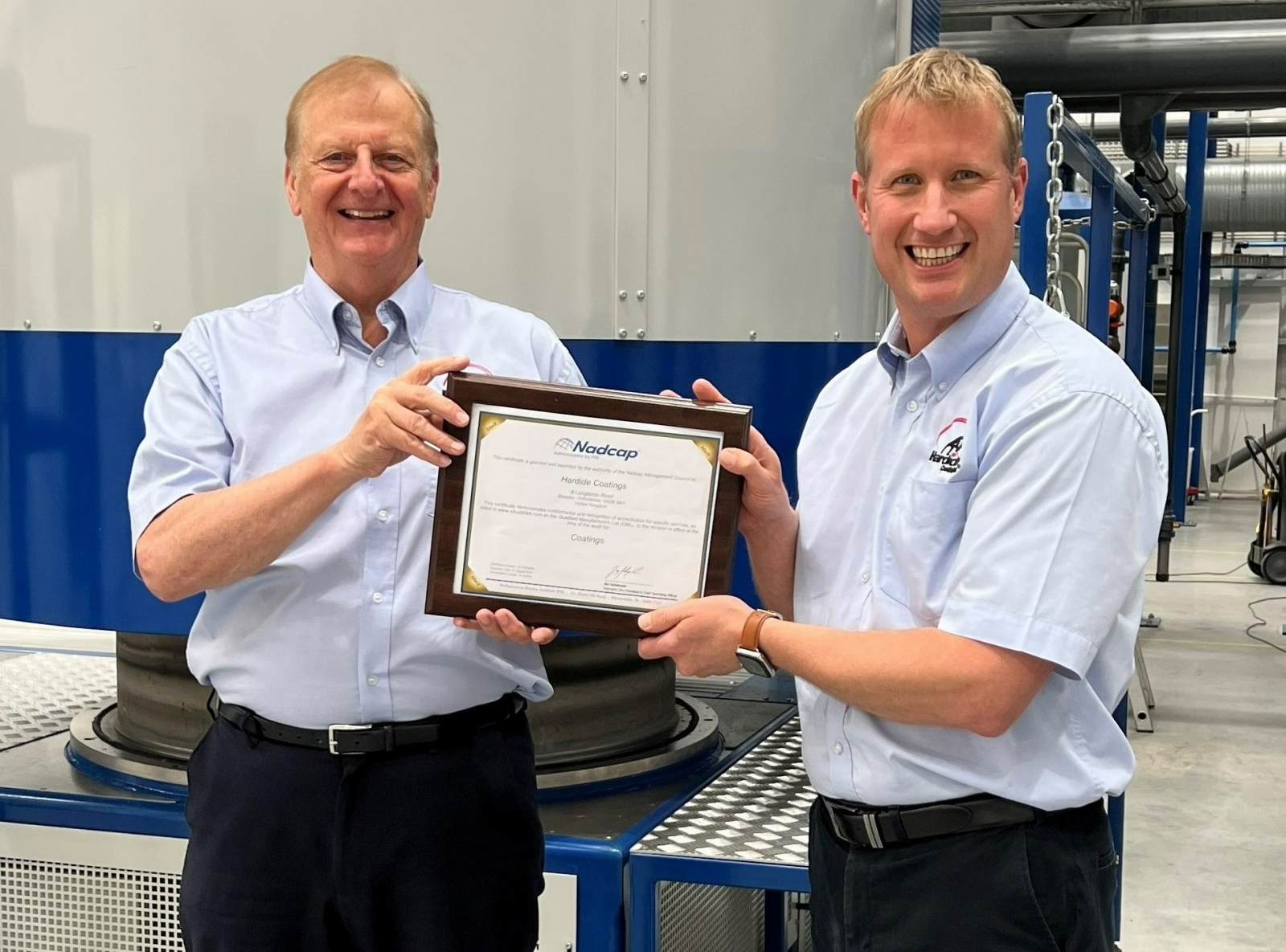 Philip Kirkham (left), CEO and Neil Jeskins (right), Quality Manager of Hardide Coatings celebrate the company’s award of Nadcap Gold Merit status.